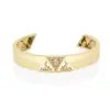 A must-have accessory, the monogram gold bangle is made up of triangular shapes and intricately finished with pavé diamonds